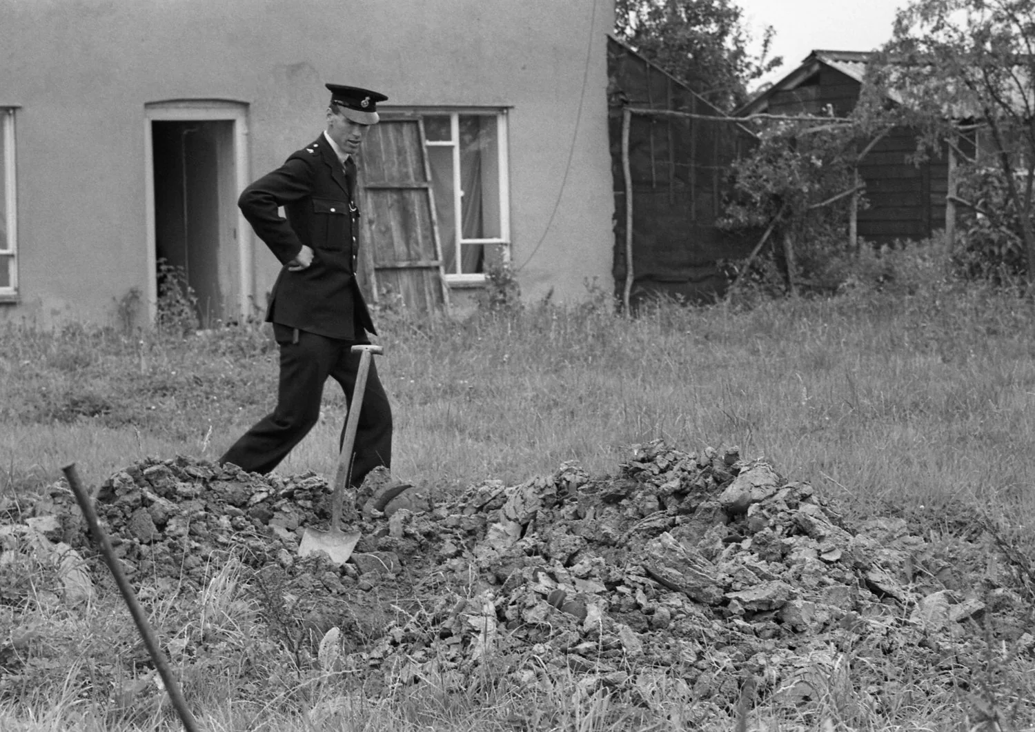 Police searching the grounds at Leatherslade Farm