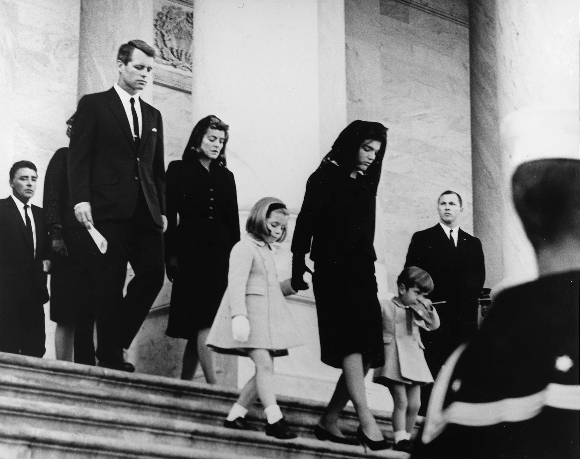 Kennedy family leaves the Capitol after the funeral
